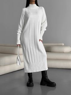 "White knitted midi dress made from premium merino yarn and cotton will keep you warm in cold weather and keep you looking elegant!  Our turtleneck dress with high cuffs and a knit pattern is suitable for a variety of occasions, a holiday party, a romantic date or a stylish casual look for every day.   DETAILS  - white  - 50% merino wool, 50 % cotton  - midi - loose fit - turtleneck  - high cuff - cozy  - warm   SIZES     This dress is available in 2 sizes S-M and L-XL   S-M  BUST up to 39\"/ 100 cm  WAIST to 39\"/ 100 cm  HIPS up to 39\"/ 100 cm  L - XL   BUST up to 43.3\"/ 110 cm  WAIST to 43.3\"/ 110 cm  HIPS up to 43.3\"/ 110 cm More selection of dresses and other clothes here https://www.etsy.com/uk/shop/ElenaKosminskaya SHIPPING Standard shipping (14-30 days) is FREE for you. Worldwi Ribbed Turtleneck Winter Dress, Winter Ribbed Knee-length Midi Dress, Winter Cable Knit Knee-length Dress, Knee-length Cable Knit Winter Dress, Ribbed Knit Turtleneck Dresses, Winter Ribbed Turtleneck Midi Dress, Casual Winter Knit Midi Dress, Casual Knit Midi Dress For Winter, Casual Midi Length Winter Sweater