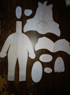 cut out paper figures on a wooden table