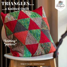 a cushion sitting on top of a wooden chair next to a window with the words triangles knitted quilt