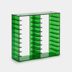 a green glass display case with multiple sections on each side and four shelves in the middle