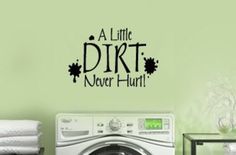 a laundry room wall decal that says a little dirt never hurt