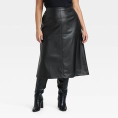 Add a modern touch to your wardrobe with this Faux-Leather Midi Skirt from A New Day™. Designed in black hue, this classic-rise midi skirt offers comfortable all-day wear. The side zipper makes it easy to take on and off, while the back slit finishes off the elegant look. A New Day™: Style that goes wherever you do. Midi Sweater Skirt, Leather Trend, Faux Leather Midi Skirt, Black Leather Skirt, Skirts With Boots, Leather Midi Skirt, Fall Capsule Wardrobe, Black Leather Skirts, Slip Skirt