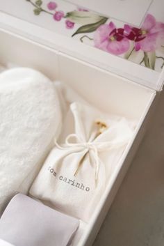 an open box with a white towel and napkin