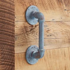 an old metal handle on a wooden door