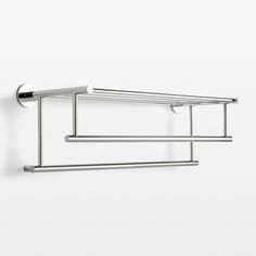 two chrome towel racks mounted to the wall