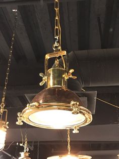 an old fashioned light fixture hanging from the ceiling