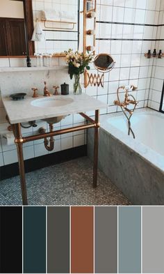 a bathroom with a sink, tub and tiled walls in shades of gray, brown, black, and white