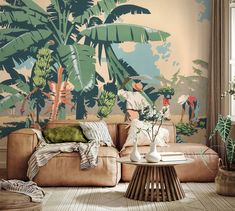 a living room filled with furniture and wallpaper covered in palm trees on the walls