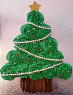 a green christmas tree made out of cupcakes