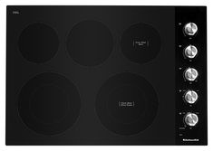 a black electric stove top with four burners