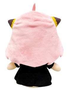 a stuffed animal wearing a pink hat with horns