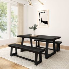 a black table and bench in a white room