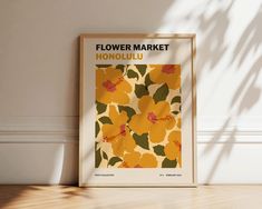 a flower market poster hanging on the wall