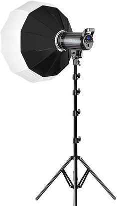 a black and white umbrella on a tripod