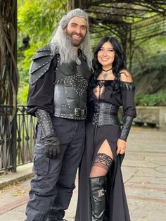 a man and woman dressed up in costumes