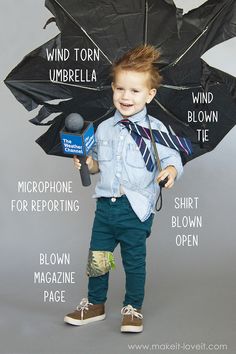 a young boy is holding an umbrella with words on it