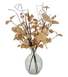 a vase filled with lots of dried leaves