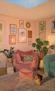 a living room filled with furniture and pictures on the wall