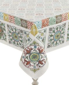 the table cloth is decorated with colorful designs