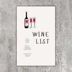 a wine list with two glasses of wine next to it on a concrete wall background