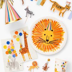 children's birthday party supplies including paper plates, napkins and decorations