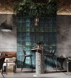 an industrial style dining room with green tiles on the wall