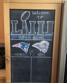 a chalkboard sign in the kitchen that says, welcome to little super bowl saints vs rams