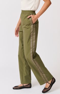 DESCRIPTION Embrace effortless style and comfort with the Milly Pant in Thyme by Cartel & Willow. These high-waisted pants are designed with a relaxed fit and feature an elastic waistband for ultimate comfort. The earthy thyme colour and subtle side stripe detailing add a modern twist to a classic silhouette. Perfect for both casual days and laid-back weekends, these pants are versatile enough to take you from brunch to beachside walks with ease. Pair the Milly Pant with a simple white tank top Style Pant, Cargo Style, Simple White, Classic Silhouette, Side Stripe, 2024 Collection, White Tank Top, White Tank, High Waisted Pants