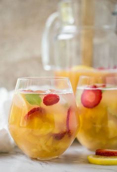 two glasses filled with lemonade and raspberry punch