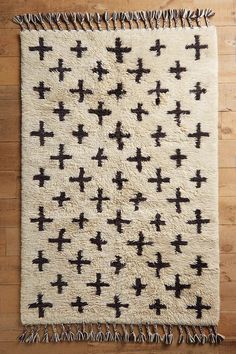 a black and white rug with crosses on it