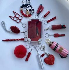 the contents of a purse are laid out in a circle on top of a white surface