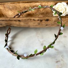 Woodland Rustic Bridal Flower Crown Base is Handmade by me. This flower crown base is an earthy tone vine and green dainty leaves and translucent bright white floating faux pearls. This is perfect to add your own flowers for a DIY boho woodland fairy crown for your wedding...or wear as-is for a rustic boho ethereal style! These are handmade by me are very sturdy as a flower crown blank base to create your own floral headband wreath. ~Flower Crown base is twisted with  strands of strong, earthy brown organic paper covered wire that is also waterproof and soft to the touch for a comfortable wear. The 3rd strand has dainty synthetic silk olive leaves, 4 th strand is made from acrylic floating faux pearls in a translucent pearly white.  ~Earthy brown flower crown base looks beautiful over any Woodland Fairy Wedding, Headband Wreath, Woodland Fairy Crown, Tiara Handmade, Twig Crown, Bridal Hair Crown, Descendants Dr, Crown Making, Ethereal Style