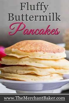 a stack of fluffy buttermilk pancakes on a white plate