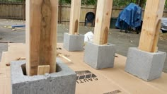 some concrete blocks sitting on top of a cardboard box