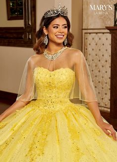 a woman wearing a yellow dress and tiara