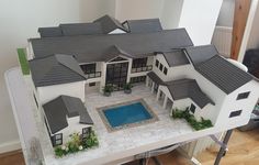 a model of a house with a pool in the middle