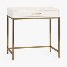 a white and gold desk with a drawer on the top, against a white background