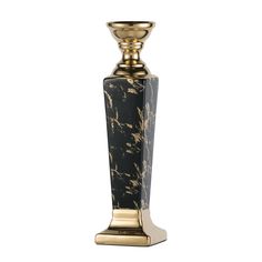 a black and gold candle holder on a white background with no one around it to see