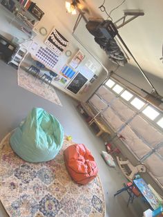 two bean bag chairs sitting on top of a rug