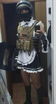 a woman dressed as a soldier taking a selfie