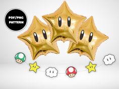 some gold foil balloons with super mario characters on them