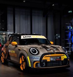 the mini electric race car is on display