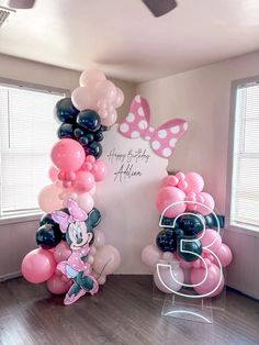 balloons are arranged in the shape of numbers and minnie mouses for a birthday party