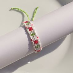 a close up of a napkin on a plate with a piece of string attached to it