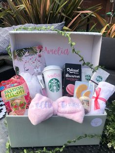 the starbucks gift box is filled with coffee, tea and other goodies for her