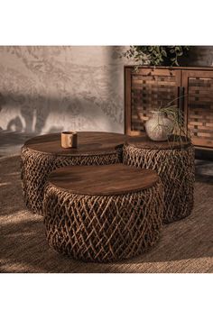 three wooden tables sitting on top of a rug