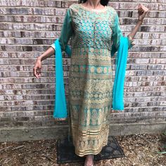 Beautiful Turquoise And Gold Salwar Kameez Two Piece Indian Outfit. Brand New Never Worn. Has Cups Sewn In At The Chest. Beautiful Swarovski Type Gold Stones Add Some Bling. Two Tone Gold And Turquoise Embroidery. Comes With Pants And Duppata! Mendhi, Wedding, Sangeet. Waist Free Size. Dress: Chest Up To 45”, Waist Up To 42”, Hip Up To 46”. Length Of Dress Up To 50”. Length Of Pants Up To 52”. Turquoise Sharara With Resham Embroidery For Eid, Turquoise Kurta With Dabka Work For Eid, Turquoise Dabka Work Sets For Eid, Turquoise Straight Kurta For Diwali, Eid Turquoise Kurta With Dabka Work, Turquoise Resham Embroidered Kurta For Eid, Turquoise Kurta With Resham Embroidery For Eid, Eid Turquoise Kurta With Resham Embroidery, Turquoise Zari Work Dress