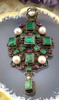 Austria-Hungary was a constitutional monarchy that was created in 1867 and was dissolved in 1918.  During this short period of time, many opulent, dramatic pieces of jewelry were produced. Close in proximity to Germany and Italy, Renaissance Revival style was a significant influence. Gothic, Biblical and Mythical themes were prevalent, as was the use of closely clustered jewels, both genuine and paste. Crafted in silver with a gold washed back, this wonderful pendant has the greenest of green em Baroque Jewelry With Historical Design For Formal Occasions, Baroque Historical Jewelry For Formal Occasions, Baroque Historical Design Jewelry For Formal Occasions, Antique Baroque Brooches With 17 Jewels, Victorian Jewelry With Historical Design For Evening, Vintage Baroque Jewelry With Historical Design, Victorian Baroque Brooches For Formal Occasions, Victorian Baroque Brooch For Formal Occasions, Ornate Baroque Brooch For Formal Occasions