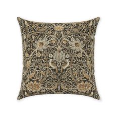 a decorative pillow with an intricate design on the front and back, made from dark brown fabric