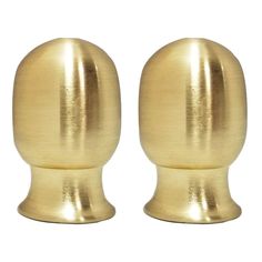 two brass colored knobs are shown on a white background and one is in the shape of an egg